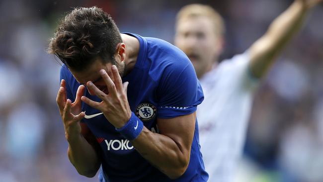 Chelsea's Cesc Fabregas reacts after getting a red card.