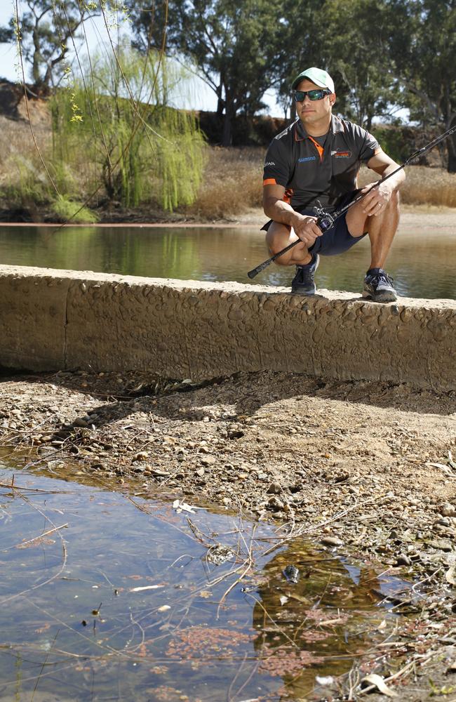 Fisherman Luke Carney at the North Dubbo Weir. Picture: Dean Marzolla