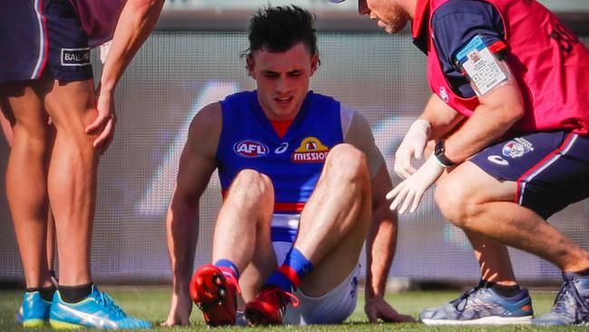 The reality of the severity of his injury kicks in for McLean. Picture: AFL Photos/Getty Images