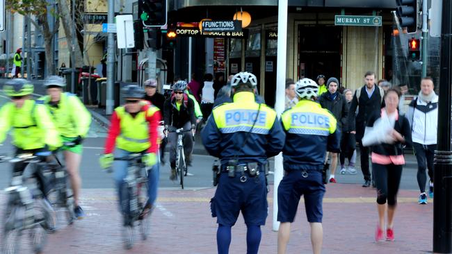 Police warning and booking people at Darling Harbour during Operation Pedro 5. Picture: Stephen Cooper