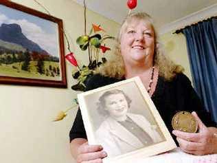 Glenda-Rae Parker of Caniaba with a 1879 Bronze Medal awarded to her great-great-great-grandmother Sarah Townsend for crocheting and a photo of her mother Joyce Lillian Coy who gave her the medal. Picture: David Nielsen