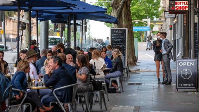 Diners in Spring St enjoy the eased restrictions. Picture: Mark Stewart