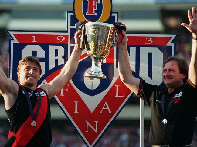 25/09/1993 PIRATE: Captain Mark Thompson and coach Kevin Sheedy hold up the Premiership Cup. 1993 Grand Final. Essendon v Carlton. MCG.