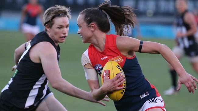 Daisy Pearce tries to escape Jess Cameron. Picture: Wayne Ludbey