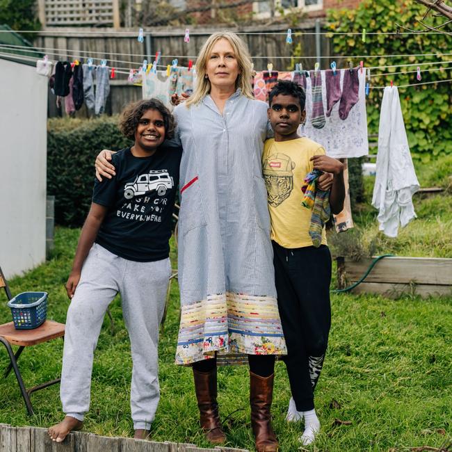 Amanda Ducker (centre) Naida and her cousin Leslie, 11, at their home in Hobart. Picture: Adam Gibson