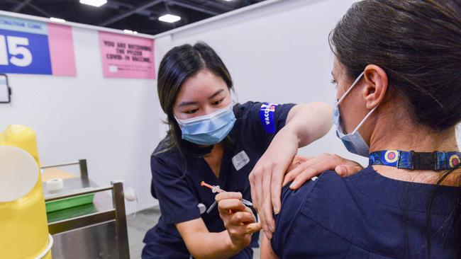 A health vaccinator administers a Covid booster vaccine at Wayville vaccination clinic. Picture: NCA NewsWire/Brenton Edwards