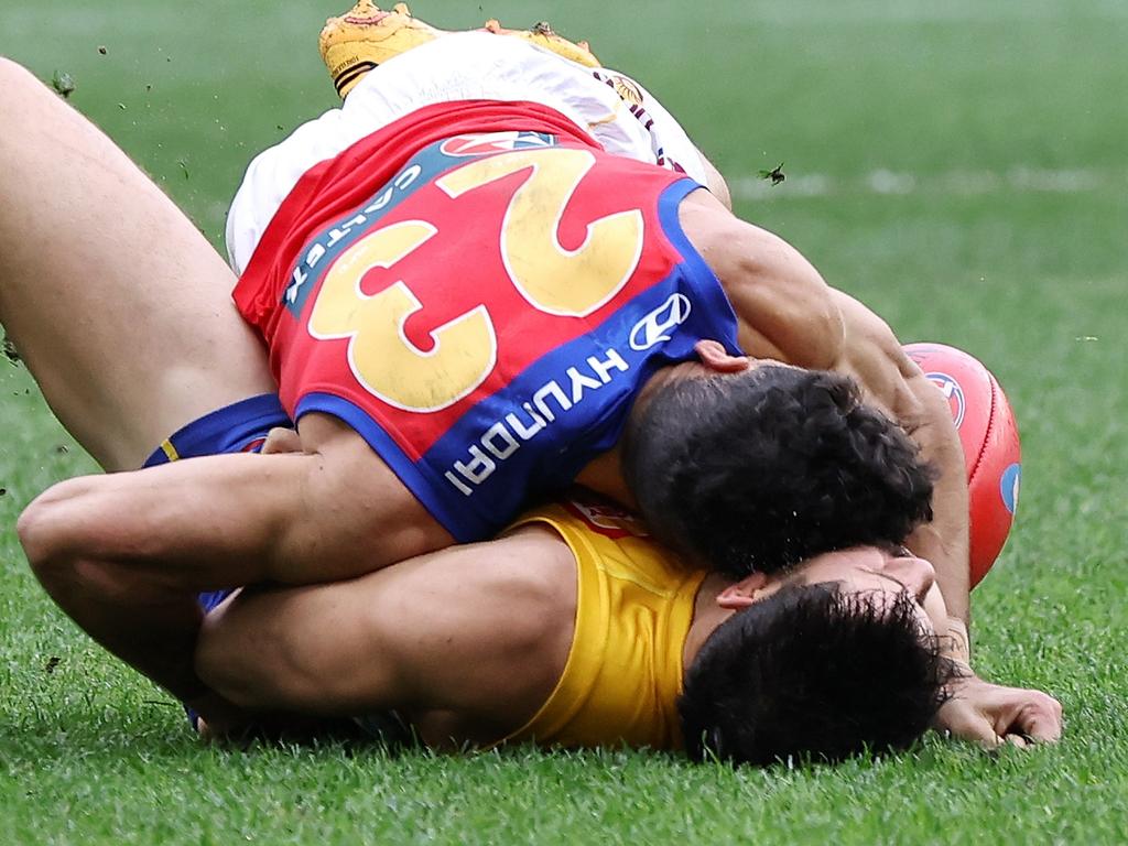 PERTH, AUSTRALIA - JULY 14: Liam Duggan of the Eagles lies concussed tackled by Charlie Cameron of the Lions during the 2024 AFL Round 18 match between the West Coast Eagles and the Brisbane Lions at Optus Stadium on July 14, 2024 in Perth, Australia. (Photo by Will Russell/AFL Photos via Getty Images)