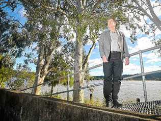 Andrew Baker in front of the riverbank at the rear of the Maclean CBD. Picture: Adam Hourigan