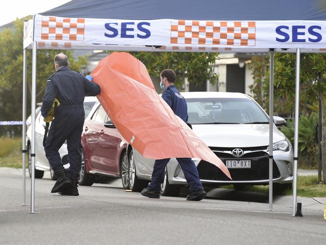 Police investigate the area around observatory Rd at Clyde North after two people were fatally stabbed. Picture: Andrew Henshaw