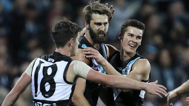 Port Adelaide players celebrate a goal against North Melbourne. Picture: Sarah Reed 