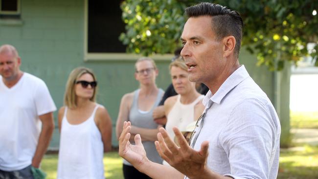 Residents meeting at Budds Beach about decrepit abandoned houses. Cr Darren Taylor addressed their concerns. Picture: Richard Gosling