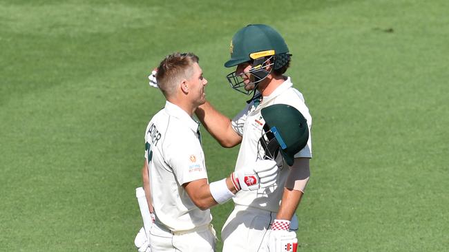 Back in the middle – Joe Burns (R) celebrates David Warner’s century. Picture: AAP