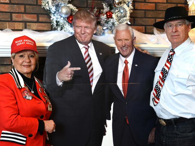 Mary Ann Tackett and William Wendt with life-size cutouts of Trump and Pence. Picture: Alex Towle