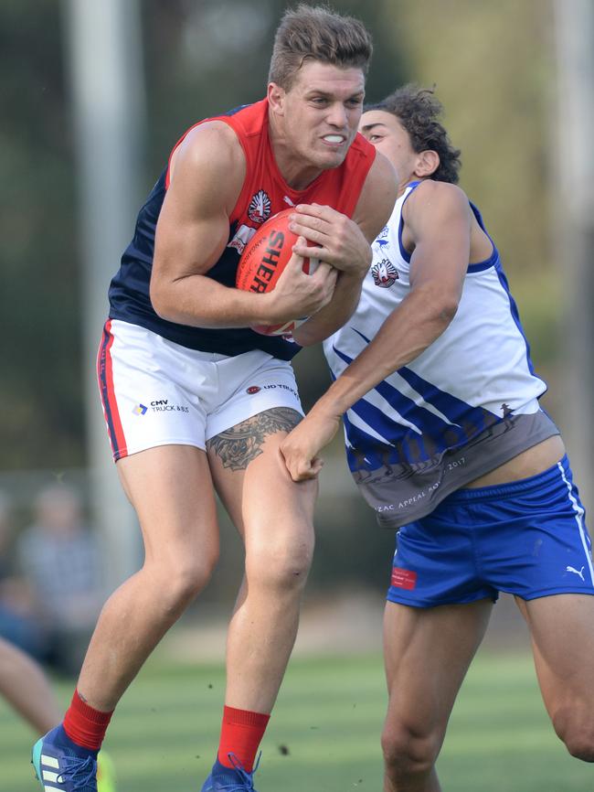 Billy Schilling takes a mark in his 150th game. Picture: Chris Eastman/AAP