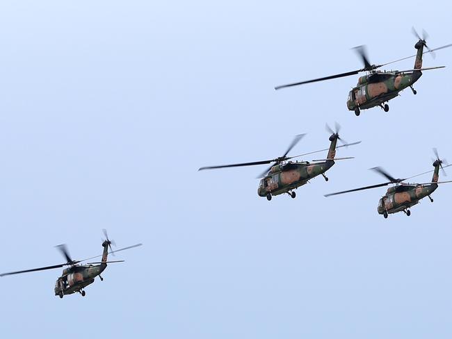 Black Hawk helicopters fly in support of a Maritime Counter Terrorist exercise in Victoria.