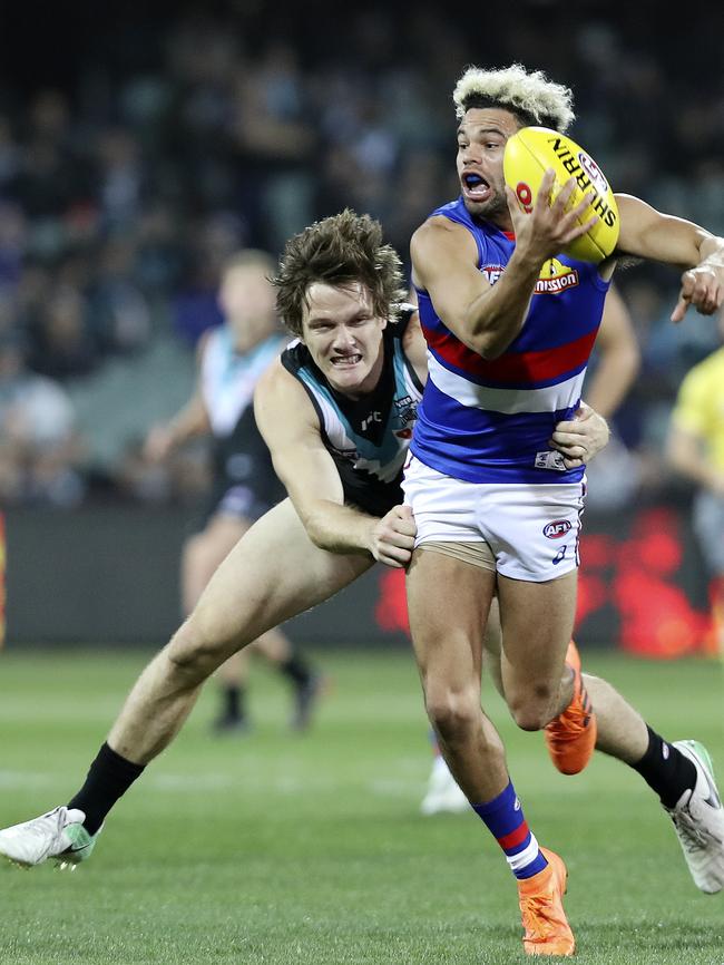 Jared Polec tackles Jason Johannisen. Picture Sarah Reed