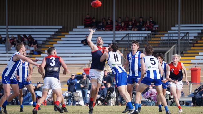 Mildura's Anthony Matthews contests a ball up inside forward 50 against Ouyen United in the Sunraysia league. Picture: Michael DiFabrizio