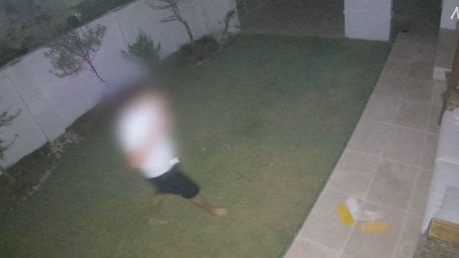 A teen was captured on CCTV in a Mermaid Waters backyard.