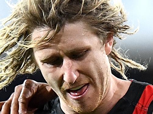 GOLD COAST, AUSTRALIA - AUGUST 19:  Dyson Heppell of the Bombers gets a kick away during the round 22 AFL match between the Gold Coast Suns and the Essendon Bombers at Metricon Stadium on August 19, 2017 in Gold Coast, Australia.  (Photo by Bradley Kanaris/Getty Images)