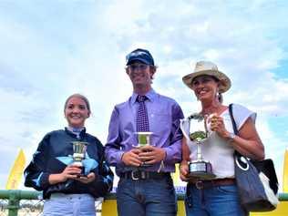 GRINNING WINNERS: Brooke Richardson with connections to the winning horse, Atouchmore. Picture: Jorja McDonnell