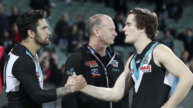 Chad Wingard with Jared Polec and Ken Hinkley after the loss Picture: Sarah Reed