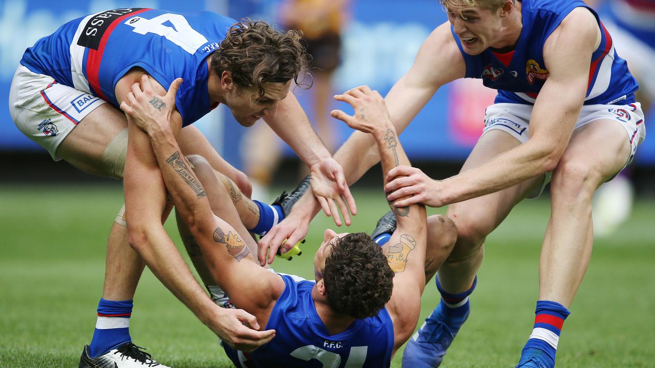 Tom Liberatore celebrates his goal with Marcus Bontempelli and Tim English. Picture: Michael Klein