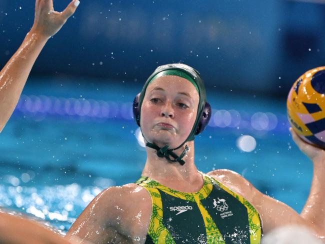 Australia's #06 Abby Andrews shoots the ball in the women's water polo preliminary round group A match between Hungary and Australia during the Paris 2024 Olympic Games at the Aquatics Centre in Saint-Denis, north of Paris, on August 4, 2024. (Photo by Andreas SOLARO / AFP)