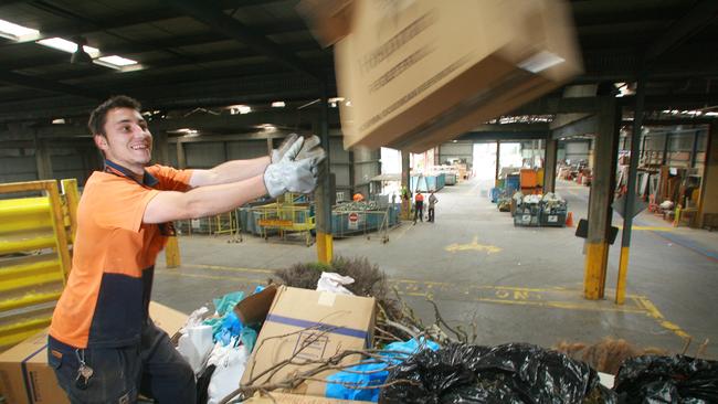 Geelong Recovery Resource Centre                                    Nth Geelong Matt Sobko (GRRC worker) cleans up a skip load a rubbish