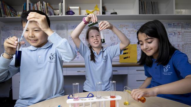 Curtis Lai, Charlotte Gorey and Ava Asadpour in the Science Shed at Balwyn North Primary School in Melbourne on Wednesday. Picture: Arsineh Houspian