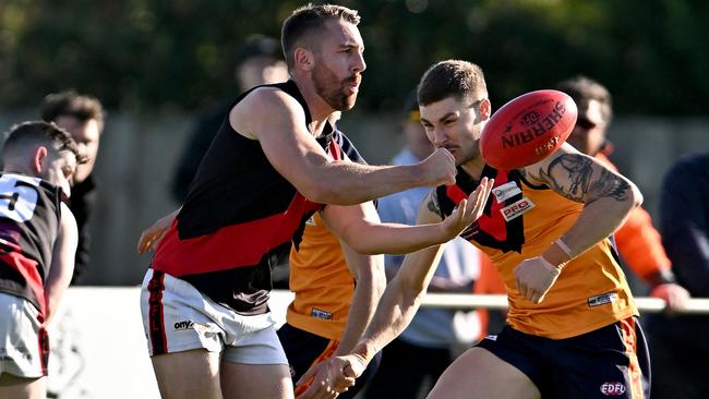 EDFL: Pascoe Vale’s Jacob Polizzi fires off a handball. Picture: Andy Brownbill