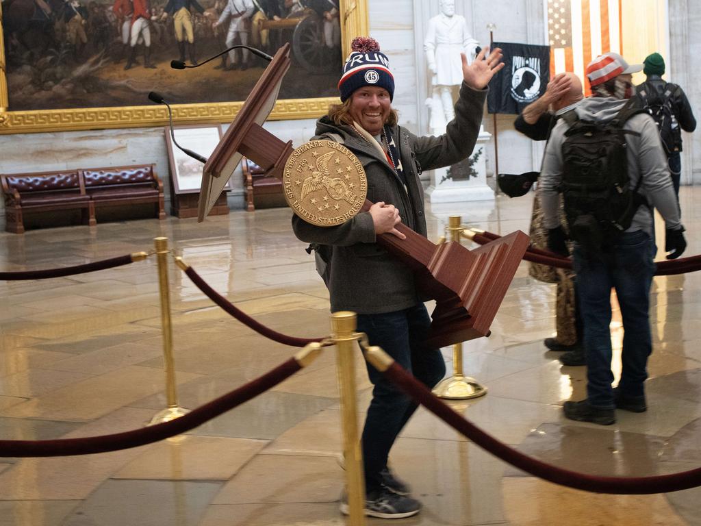 Another rioter took Pelosi’s speaker’s lectern. Picture: AFP