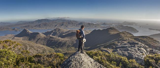 Peter Marmion on the summit of Mount Berry. The image features in Peter's new book Hidden Worlds. Picture: Jimmy Emms/Hobart Yachts