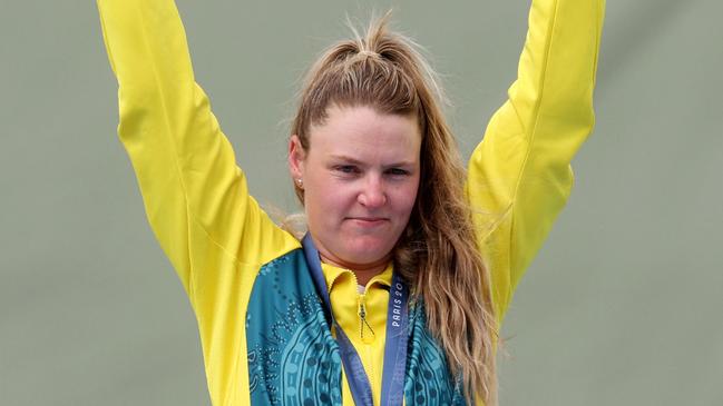 Bronze medallist Australia's Penny Smith poses on the podium of the shooting trap women's final. (Photo by Alain JOCARD / AFP)