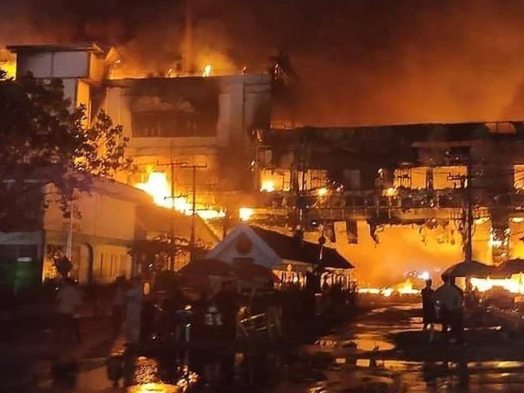 Firefighters and rescue workers gather at the site of a fire at the Grand Diamond City hotel-casino. Picture: AFP