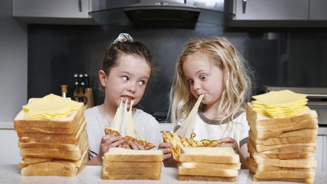 Five-year-olds Charlotte and Matisse love a good cheese toastie, no matter what it’s called. Picture: David Caird