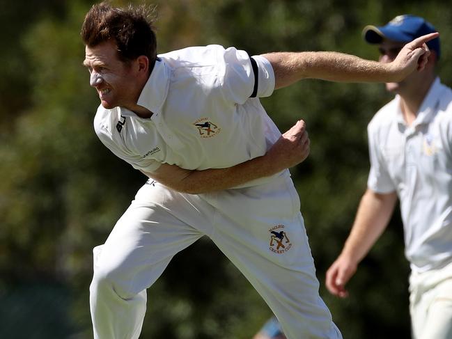 Macleod captain-coach Tim Wise sends one down in last season’s grand final. Picture: Mark Dadswell