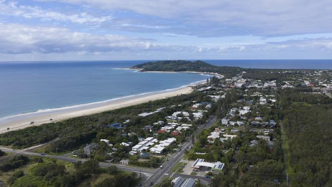 BYRON BAY, AUSTRALIA - JUNE 20: An aerial view of Byron Bay  on June 20, 2020 in Byron Bay, Australia. Domestic tourists have started to return to Byron Bay following the easing of travel restrictions imposed due to the COVID-19 outbreak. All intrastate travel restrictions were lifted in NSW on June 1, allowing people to travel to regional areas within the state. Although borders between NSW, the ACT and Victoria remain open, Australians have been asked not to holiday interstate. Queensland, Western Australia and Tasmania's state borders remain closed, while South Australia is only open to travellers from WA, Tasmania and the Northern Territory while interstate arrivals to the Northern Territory must self isolate for 14 days. (Photo by Brook Mitchell/Getty Images)