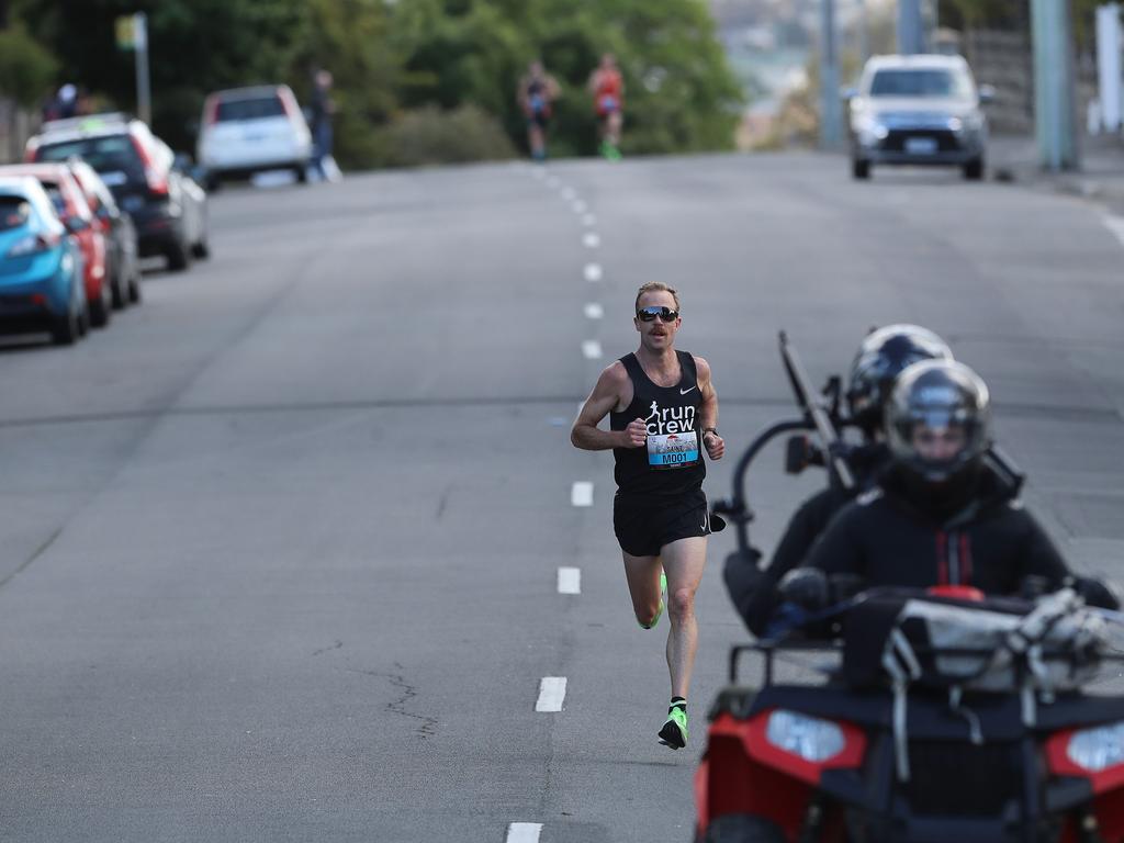 2018 winner Ben St Lawrence has a commanding lead early in the 2019 Point to Pinnacle as runners make their way up Davey Street. Picture: LUKE BOWDEN