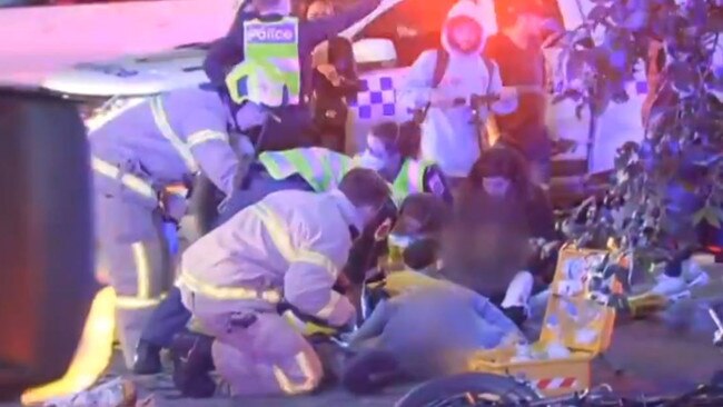 Emergency crews work to help the victims of the crash. Picture: Seven News