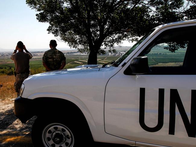 UN peacekeepers look out towards Syria from the Israeli-annexed Golan Heights. Picture: AFP