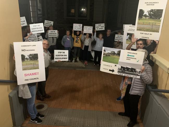 Protestors expressing their views on the proposed Alberton Oval redevelopment at Tuesday night's Port Adelaide Enfield Council meeting. Picture: Paula Thompson