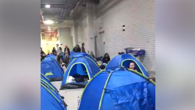 Screenshots from a video uploaded to social media shows fans camping out in tents at a loading dock at Pacific Fair.