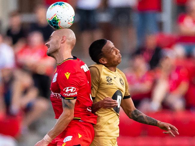 Adelaide United’s James Troisi wins a header above Western Sydney Wanderers’ Kearyn Baccus. Picture: Getty Images