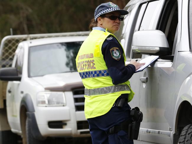 . 19/9/2014The Australian / Picture David MoirPolice stop and interview drivers near to the  entrance of Benaroon Drive in Kendall, NSW where 3 year old William Tyrell disapeared from last weekend . 19/9/2014The Australian / Picture David Moir