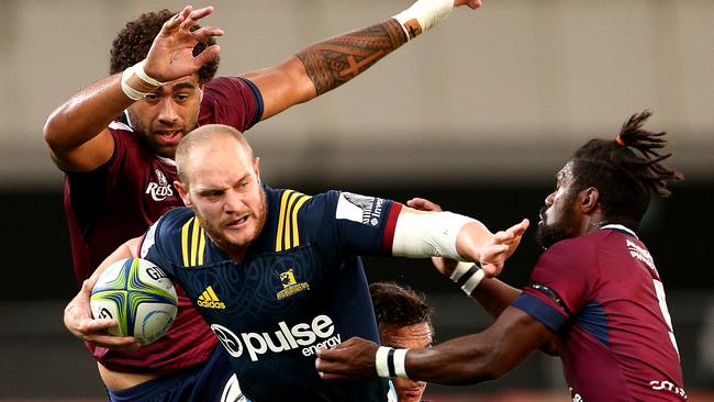 Matt Faddes tries to fend off Moses Sorovi.