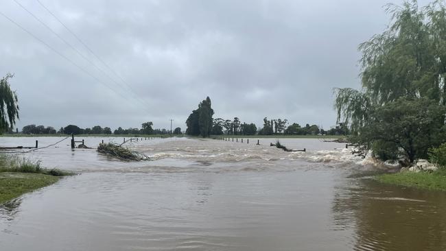 Two people have been rescued after their truck got struck in flood waters on McKinnons Rd in Tinamba on Friday morning. Picture: Jack Colantuono