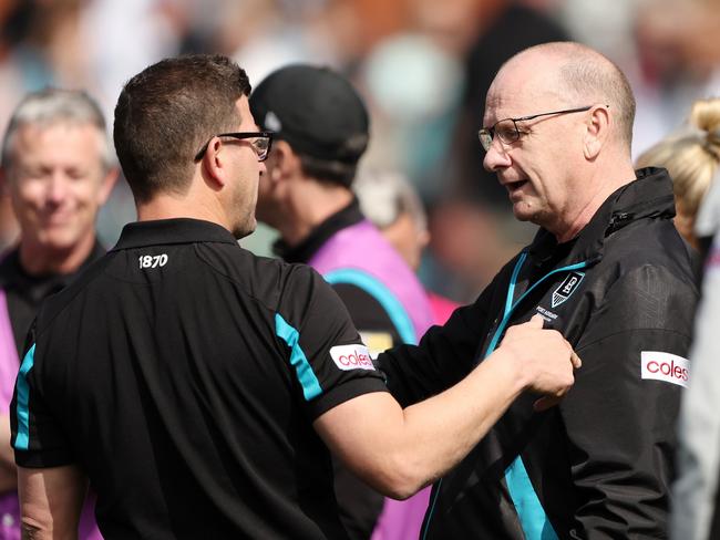 Josh Carr and Hinkley speak during a game in 2023. Picture: Sarah Reed/AFL Photos via Getty Images