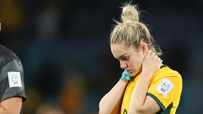 SYDNEY, AUSTRALIA - AUGUST 16: Teagan Micah and Ellie Carpenter of Australia look dejected after the team's 1-3 defeat following the FIFA Women's World Cup Australia & New Zealand 2023 Semi Final match between Australia and England at Stadium Australia on August 16, 2023 in Sydney, Australia. (Photo by Catherine Ivill/Getty Images)