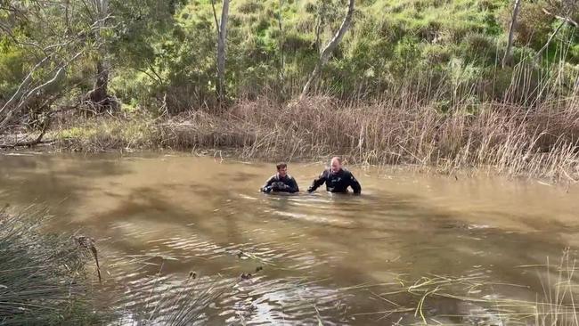 Victorian homicide detectives and police divers search a river near Melbourne for remains of missing Adelaide man Kerry Giakoumis. Picture Vic Police