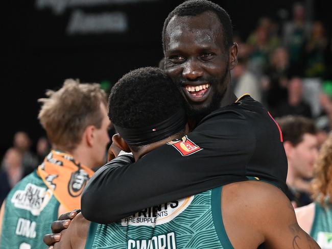 Majok Deng embraces Craig Sword after the Jackjumpers upset win. Picture: Steve Bell/Getty Images